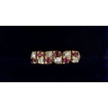 A 9 carat gold ring set chequered row of six diamonds and six rubies, 1.9g, size K