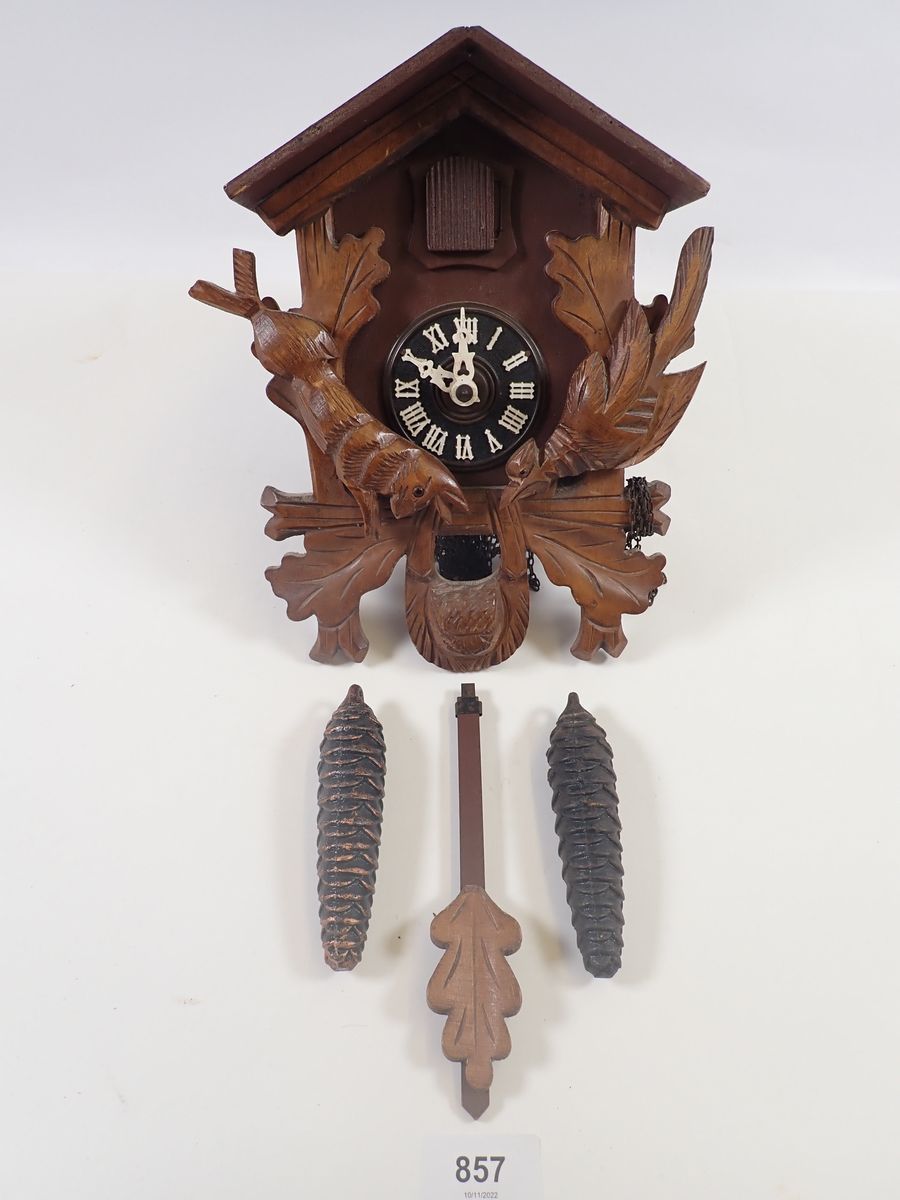 A Black Forest cuckoo clock with weights and pendulum