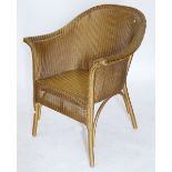 A gold Lloyd Loom chair