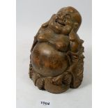 An early 20th century Chinese bamboo root carving of laughing Budha, 18cm tall