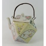 A Japanse faceted teapot painted reserves of birds, flowers and landscapes with bamboo handle