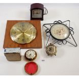 A collection of five clocks including a Junghans astra quartz, a Smiths sectric bakelite clock, a