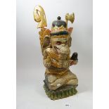 A large Balinese painted and carved elephant god figure, 45cm