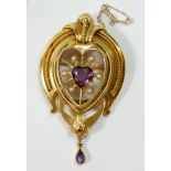 A large Victorian brooch set central heart cut amethyst within pearl surround and ornate yellow