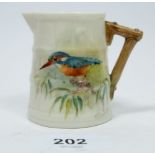 A Royal Worcester minature jug with hand painted kingfisher design, signed N Powell, 6cm