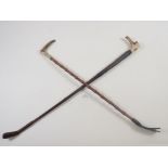 Two horn handled riding crops