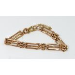 A 9 carat gold gatelink bracelet with later added metal clasp, 9g
