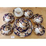 An Edwardian Royal Albert tea service comprising twelve cups and saucers, two cake plates, sugar and