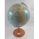 A globe on wooden base