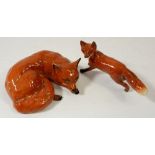 A Beswick fox standing and another reclining