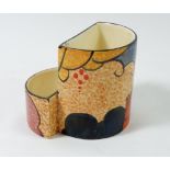 A Clarice Cliff cigarette and match holder marked Cafe au Lait, Bizarre, Newport Pottery