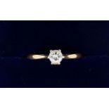 An 18 carat gold solitaire diamond ring, size J