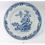 A Chinese Qing Dynasty blue and white large meat plate painted peony tree, 38cm