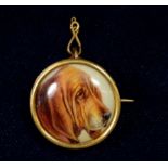 A Victorian porcelain circular brooch painted dog and signed W B Ford 1888, in yellow metal