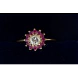 A 9 carat gold ruby and diamond cluster ring, centre stone approx 1/4 carat, 1.8g, size J