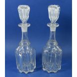 A pair of 19th century glass ribbed decanters and stoppers