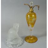 A moulded glass dog, 14cm and an amber flashed glass atomiser