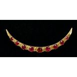 A 15 carat gold crescent form brooch set ruby and diamonds, 4.5cm, total weight 3g