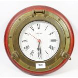 A novelty quartz porthole style wall clock