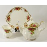 A Royal Albert Country Roses tea service comprising twelve cups and thirteen saucers, three sugar