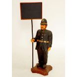 A novelty floor standing figure of a Policeman holding chalk board sign, 84cm tall