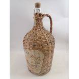 A wicker clad large Portuguese wine bottle, 38cm