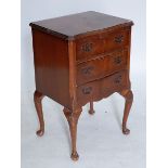 A reproduction small mahogany bedside chest of three drawers, 46cm wide