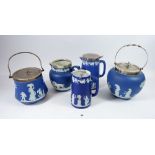 A Wedgwood group of early 20th century Jasperware comprising two biscuit barrels, two water jugs and