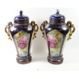 A pair of Victorian large blue and floral vases and covers, 41cm tall