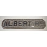 An early 20th century cast iron street sign for 'Albert Rd' from Abergavenny museum, 78cm long