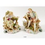 A pair of 19th century Volkstedt porcelain figures of man with a bird cage and companion with