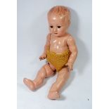 A vintage composition doll with cry