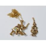 A 9 carat gold elephant pendant on chain, boxed and a novelty crown pendant, 11g