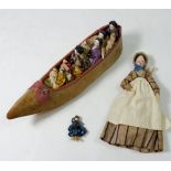 A Victorian 'Old Woman Who Lived in a Shoe' set with fabric shoe filled with porcelain headed