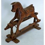 A carved wood rocking horse on stand, 89cm tall