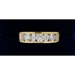 An 18 carat gold ring set three brilliant cut diamonds and four baguette cut diamonds, size N, total