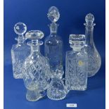 Five cut glass decanters and two water jugs