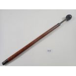 A Victorian short measuring stick with ebony knob terminal and silver collar - thought to be for
