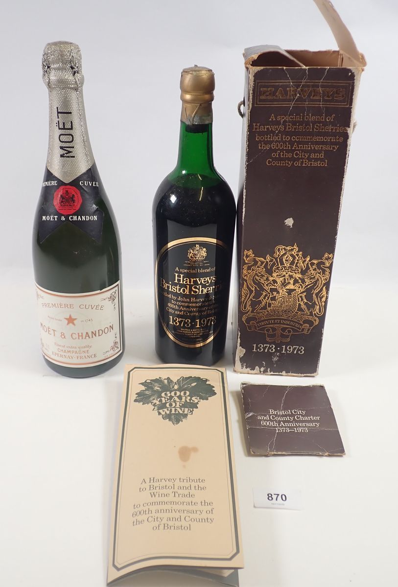 A Harveys 1373-1973 600th anniversary bottle of sherry together with a bottle of Moet and Chandon