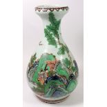 A Chinese famille verte vase decorated figures in a landscape, 30cm