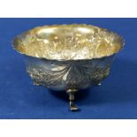 A silver circular sugar bowl with embossed floral and swag decoration, Chester 1898, 93 g by