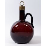 A 19th century brown glass wine flagon with brass stopper