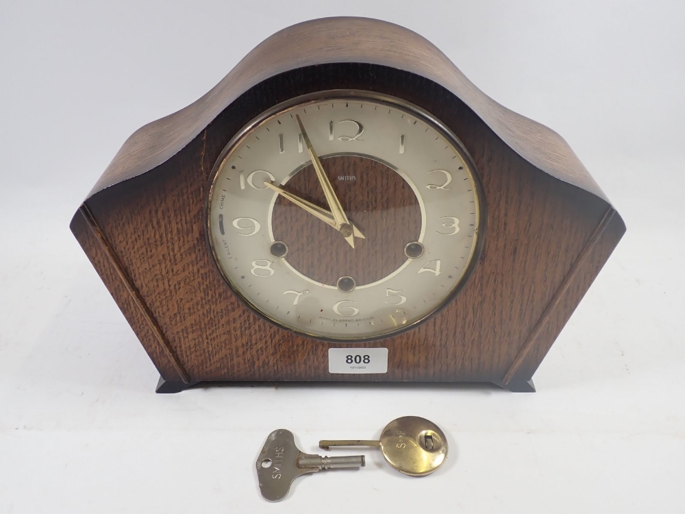 A Smiths oak striking mantel clock