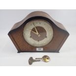 A Smiths oak striking mantel clock