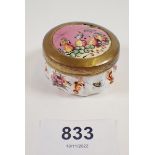 A 19th century enamel circular pill boxpainted fruit and flowers, 4.5cm diameter, a/f