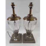 A pair of reproduction cut glass and gold metal urn form table lamps, 43cm tall