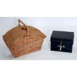 A wicker basket or hamper and an old despatch box