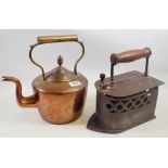 A Victorian large iron with pierced decoration and a large copper kettle