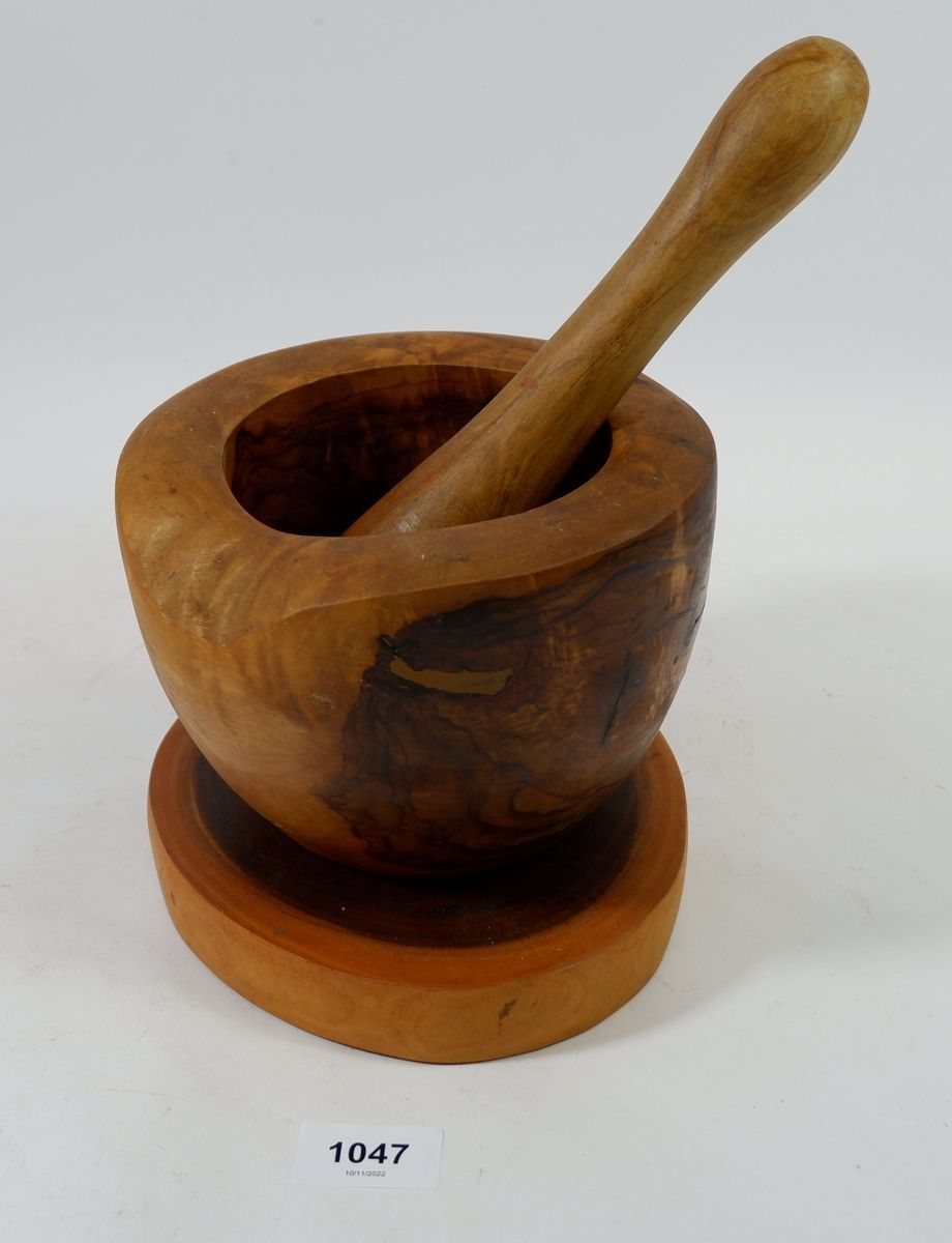 A Lignum Vitae pestle and mortar on stand, 17cm diameter