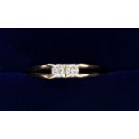 A 9 carat gold two stone diamond ring on split shank, 1.4g, size J